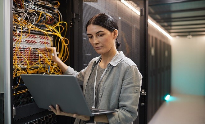 female-network-technician-inspecting-servers-in-da-2022-02-01-22-36-30-utc-1-1